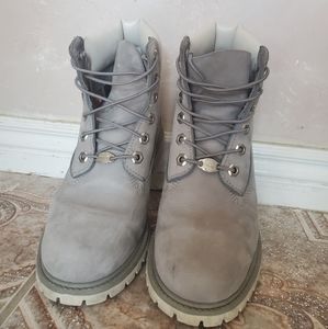 Light grey moderately worn women timberlands size 7.5